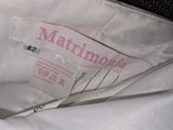 a label on a white shirt that says martinionia