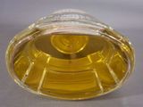 a glass container with a yellow liquid inside of it
