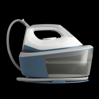 an image of a blue and white steam iron on a black background