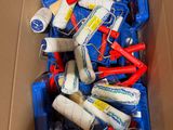a cardboard box filled with assorted items like toothbrushes, toothpaste, toothpaste, toothpaste, and toothpaste