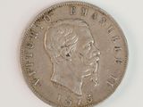 a close up of a coin with a woman ' s face on it