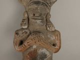 statue of a woman holding a baby in her arms