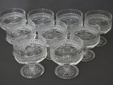 a lot of glasses that are sitting on a table
