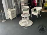 two wicker chairs and a table in the corner of a room
