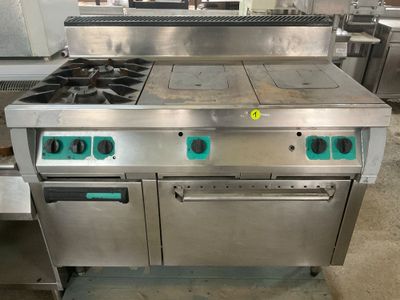 a large stainless steel stove with two burners and two ovens