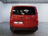 a red van that is parked inside of a building