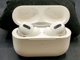 a pair of airpods sitting in a case on a table