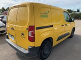 a yellow van that is parked in a parking lot