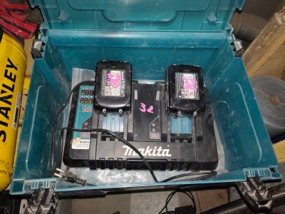 two batteries in a blue box on a table