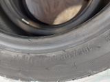 a close up of a tire on a white surface