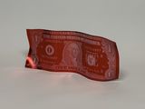 a red one hundred dollar bill on a white surface