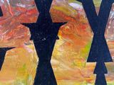 a painting of three crosses painted on the side of a building