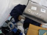 a pile of luggage sitting on top of a bed