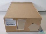 a cardboard box with a sticker on it sitting on a table