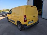 a yellow van that is parked in a parking lot