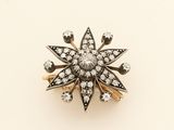 a close up of a ring with diamonds on a white surface