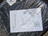 a piece of plastic wrapped in plastic sitting on the ground