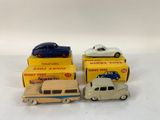three toy cars are sitting on top of each other in a box