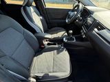 the interior of a car with the front seats folded down