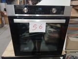 a black and silver oven with a price tag on it