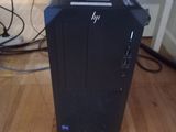 a black desktop computer sitting on a hard wood floor