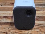 an apple speaker sitting on top of a wooden table
