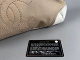 chanel beige and white canvas bag with cc logo