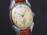 an image of a close up of a wrist watch on a black background