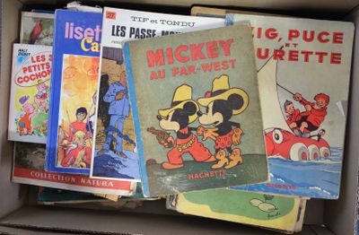 many books in a box that are sitting on top of each other