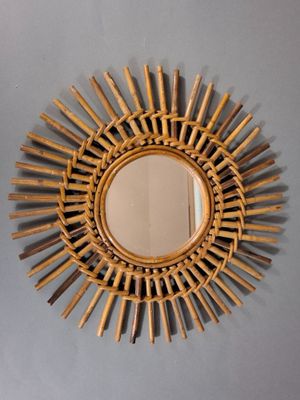 a mirror that is hanging on the wall in the room