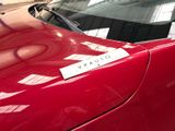a sticker on the hood of a red car