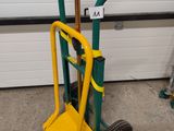 a small hand truck with a yellow handle and a green handle