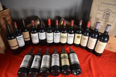 several bottles of wine are lined up on a table