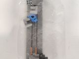 a plastic box with a toy gun inside of it