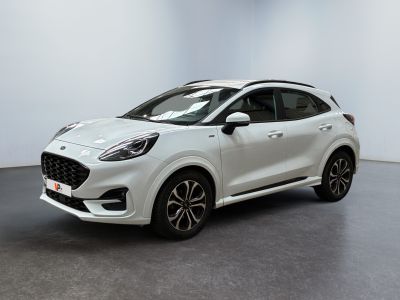 a white car parked in a room with a black floor