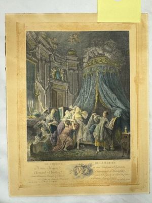 une vieille photo montrant un groupe de personnes rassemblées autour d'un lit
