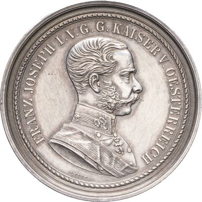 une image représentant une pièce d'argent sur laquelle figure le portrait d'un homme