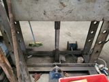 a red box that is sitting on the floor next to a machine