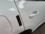 a close up of a car door with a sticker on it