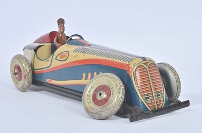 a small toy car with a man in the driver ' s seat