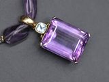 an amethorate and amethorate necklace with a gold clasp
