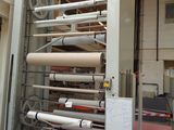 a machine that is working on a roll of paper