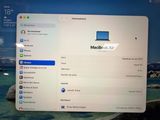 a computer screen with a picture of a macbook air on it