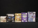 a lot of video games on a black table