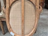 a wooden chair with a round back and a round seat