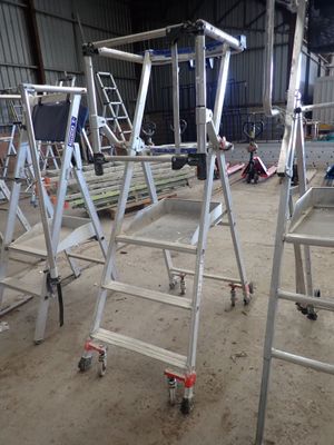 many ladders that are sitting in a building