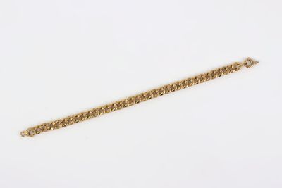 a gold chain bracelet with a clasp on a white background