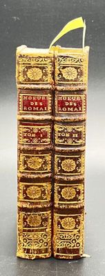 two books that are sitting side by side on a table