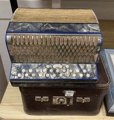 three accordions sitting on top of each other on a table