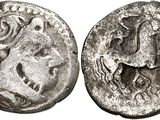 a silver coin with an image of a man on it